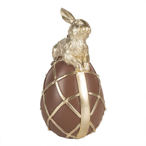 Hase auf Schokoladenei, braun gold